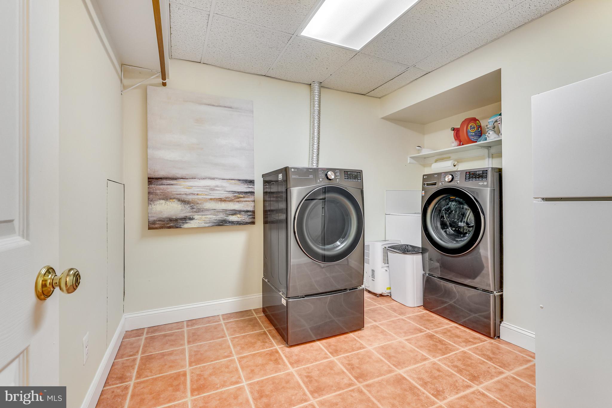 6804 Baron Road McLean, VA 22101 - Photo 54 of 66 Laundry with Sink, Shelving and hanging spaces