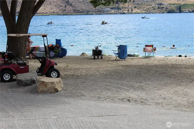a sign that is sitting in front of flowers