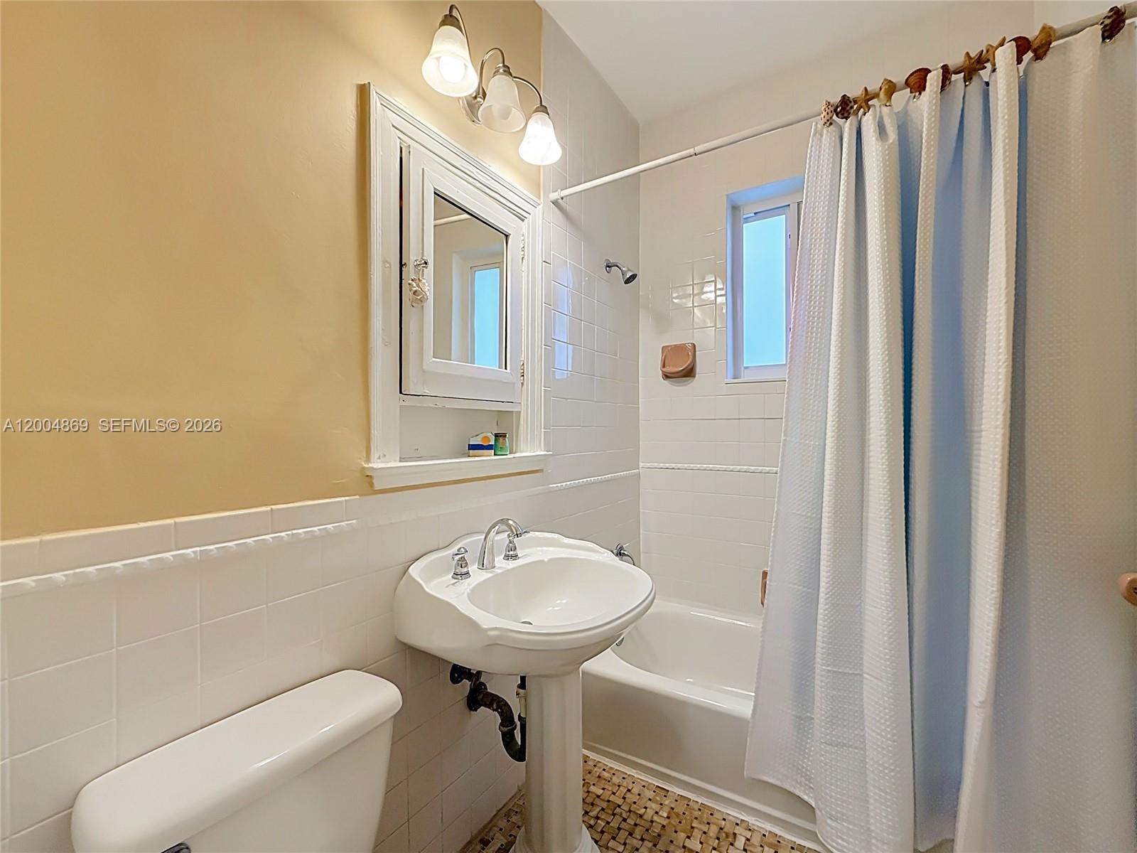 1029 Harrison Street Hollywood, FL 33019 - Photo 31 of 74 One of three full bathrooms - this one with combined tub/shower