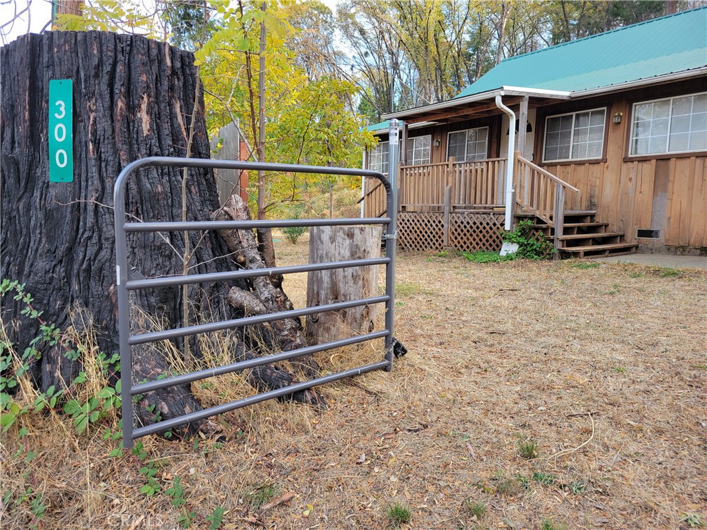 300 Bald Rock Road Berry Creek, CA 95916 - Photo 2 of 45 a view of a small house with wooden fence