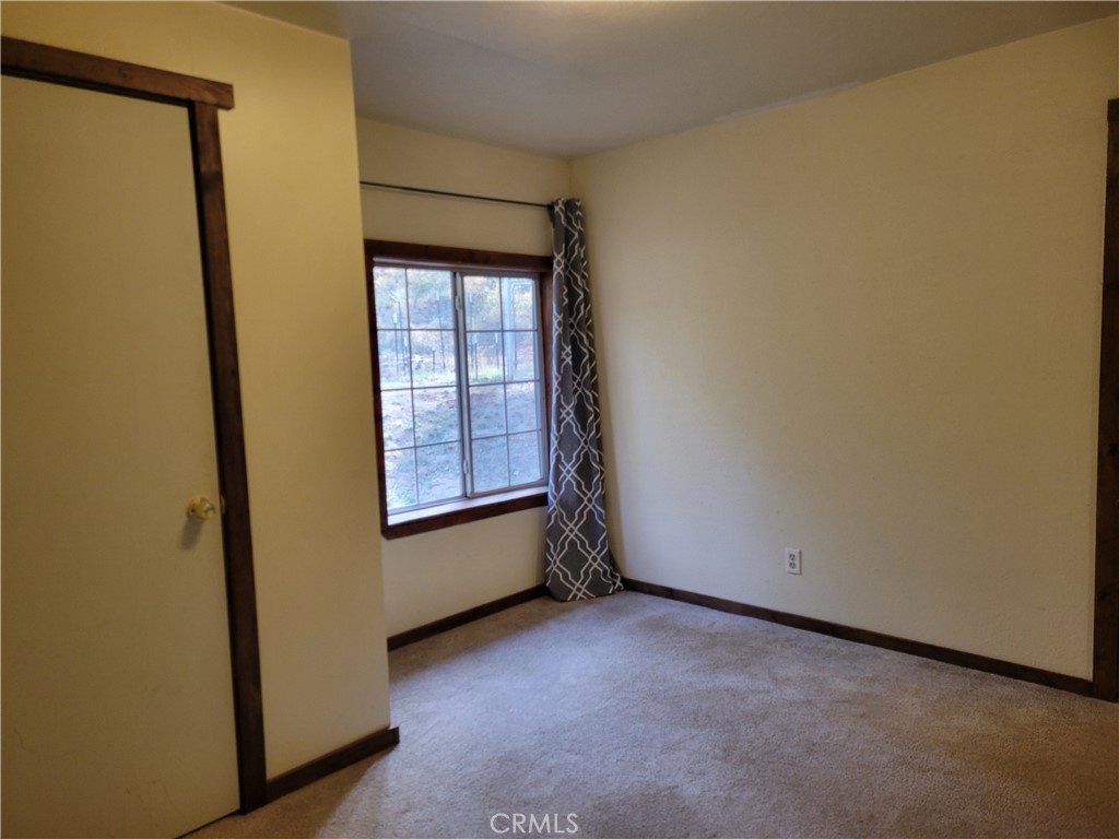 300 Bald Rock Road Berry Creek, CA 95916 - Photo 21 of 45 an empty room with windows