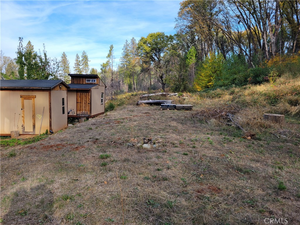 300 Bald Rock Road Berry Creek, CA 95916 - Photo 41 of 45 a view of a fire pit with large trees