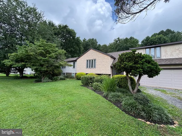 a house view with a garden space