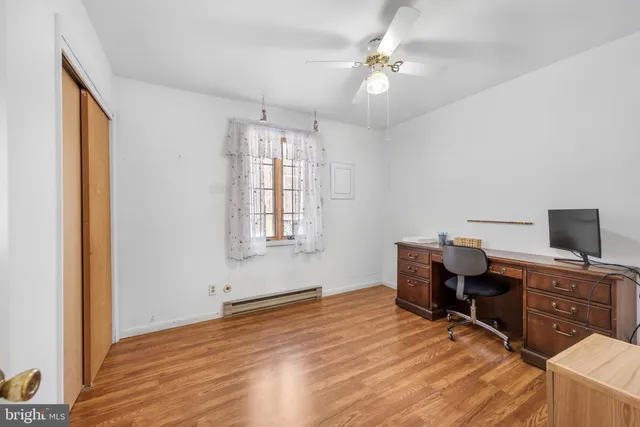 a bedroom with a workspace