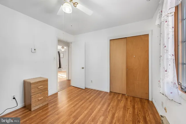 a view of a livingroom with wooden floor