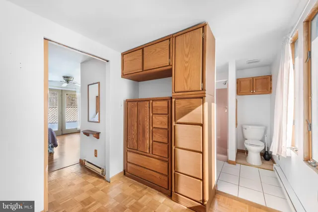 a spacious bathroom with a shower and a toilet
