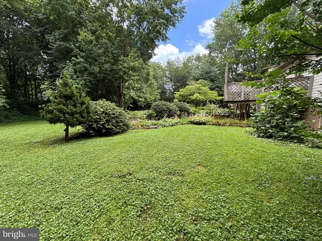 a view of a garden with a building in the background