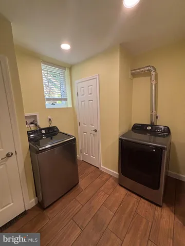 a kitchen with stainless steel appliances granite countertop a stove and a refrigerator