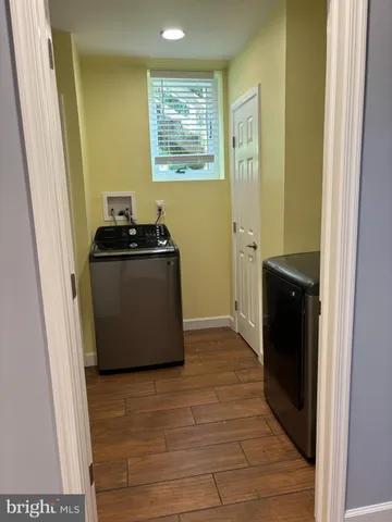 a view of a kitchen with wooden floor