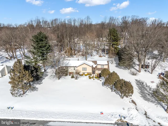 a view of a city with snow on the road