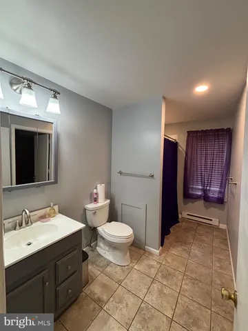a bathroom with a sink and a toilet