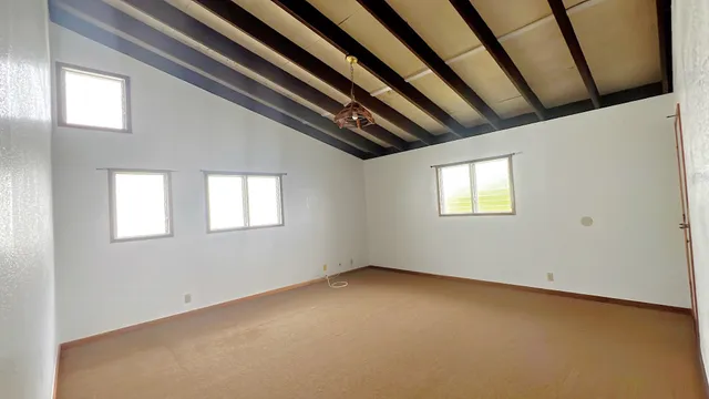 a view of empty room with windows