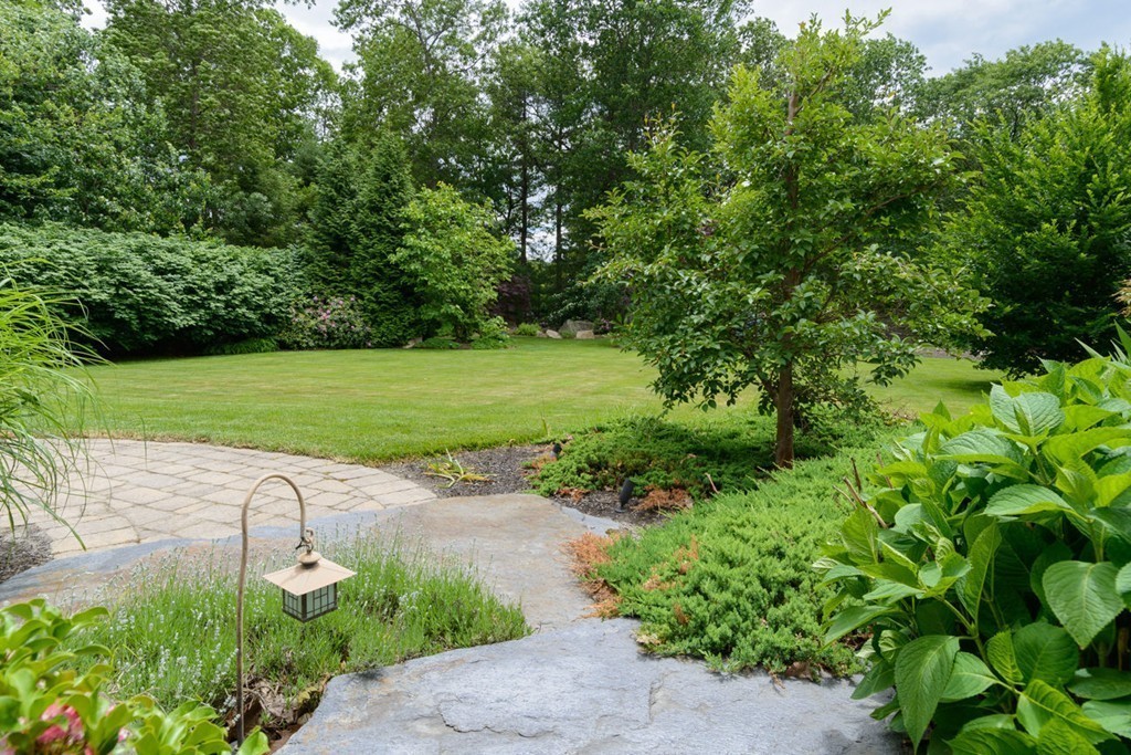 35 Norwich Road Wellesley, MA 02481 - Photo 22 of 25 a view of a street with a yard and a fountain