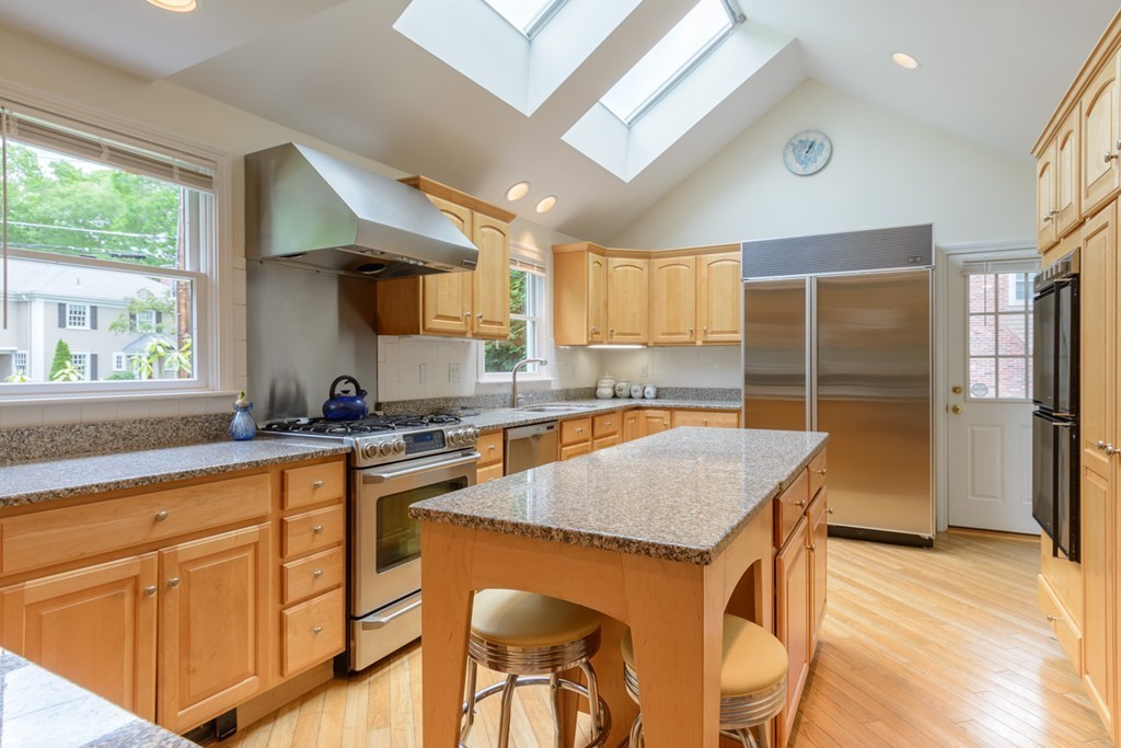 35 Norwich Road Wellesley, MA 02481 - Photo 5 of 25 a kitchen with granite countertop kitchen island wooden cabinets and stainless steel appliances