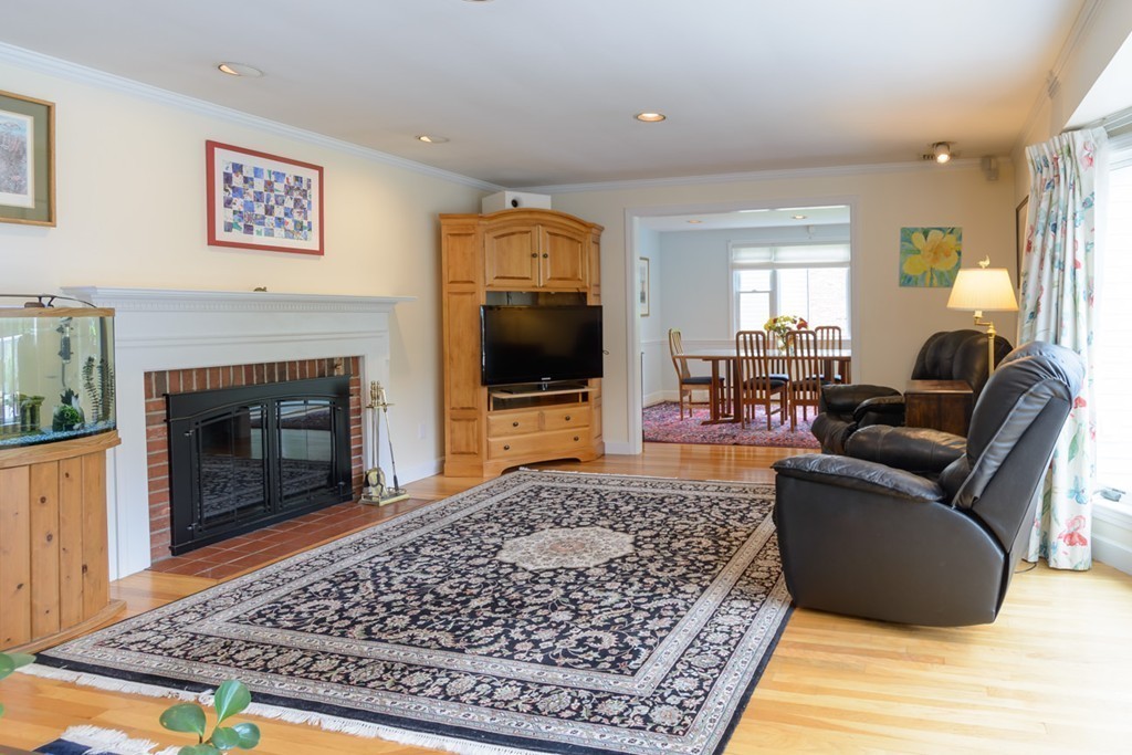 35 Norwich Road Wellesley, MA 02481 - Photo 7 of 25 a living room with a couch a rug and a fireplace