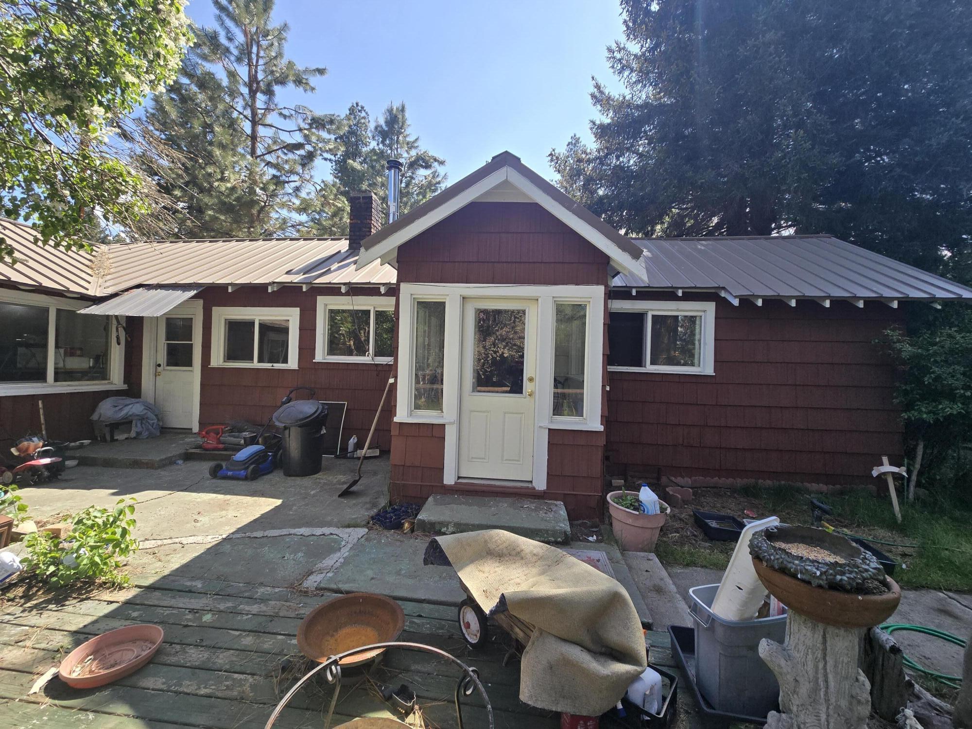 409 East Ash Street Chiloquin, OR 97624 - Photo 2 of 37 a view of a house with backyard and sitting area