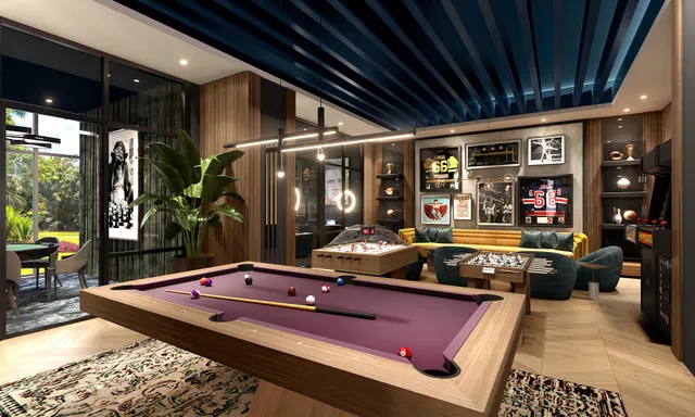 a living room with pool table and a table