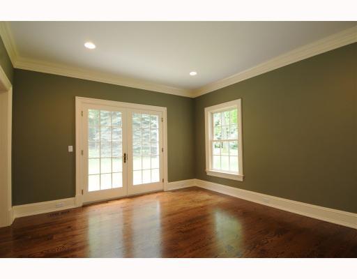 Undisclosed Address Darien, CT 06820 - Photo 11 of 17 a view of an empty room with wooden floor and a window