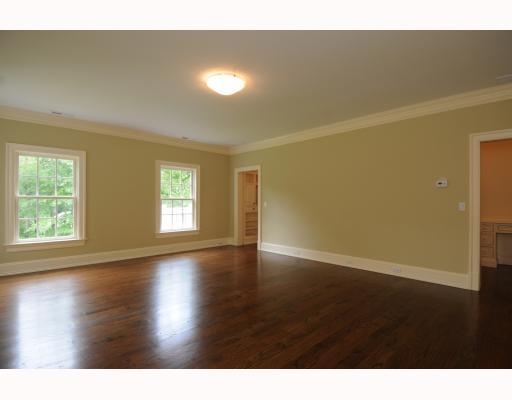 Undisclosed Address Darien, CT 06820 - Photo 12 of 17 a view of an empty room with wooden floor and a window