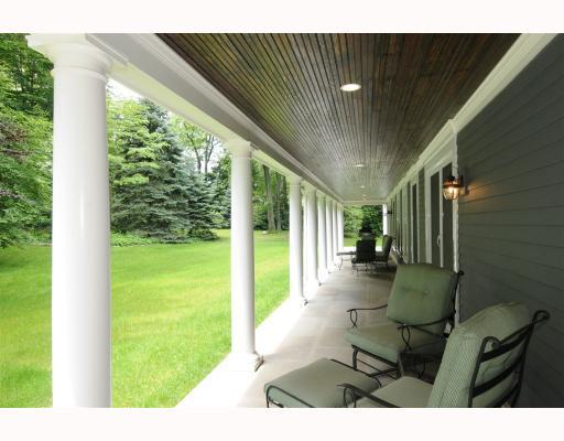 Undisclosed Address Darien, CT 06820 - Photo 16 of 17 a view of a porch with furniture and floor to ceiling window