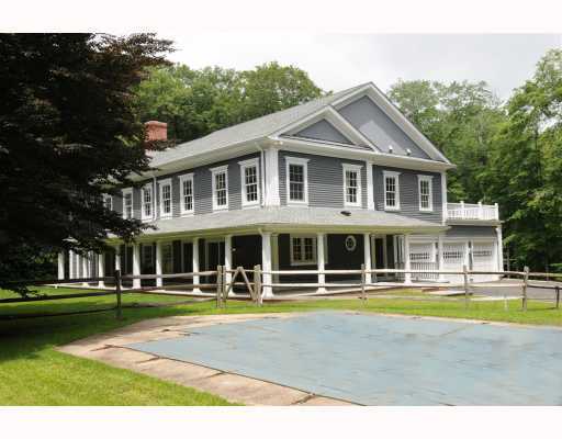 Undisclosed Address Darien, CT 06820 - Photo 17 of 17 a view of a large building with a swimming pool