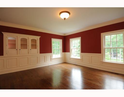 Undisclosed Address Darien, CT 06820 - Photo 6 of 17 a view of an empty room with wooden floor and windows