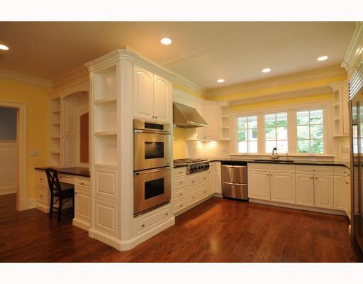 Undisclosed Address Darien, CT 06820 - Photo 7 of 17 a kitchen with stainless steel appliances kitchen island granite countertop a stove a sink and a refrigerator