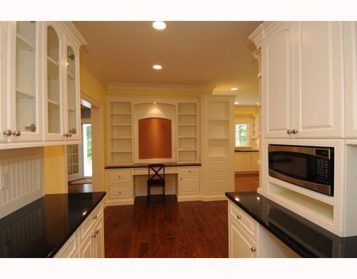 Undisclosed Address Darien, CT 06820 - Photo 8 of 17 a open kitchen with a sink and breakfast area