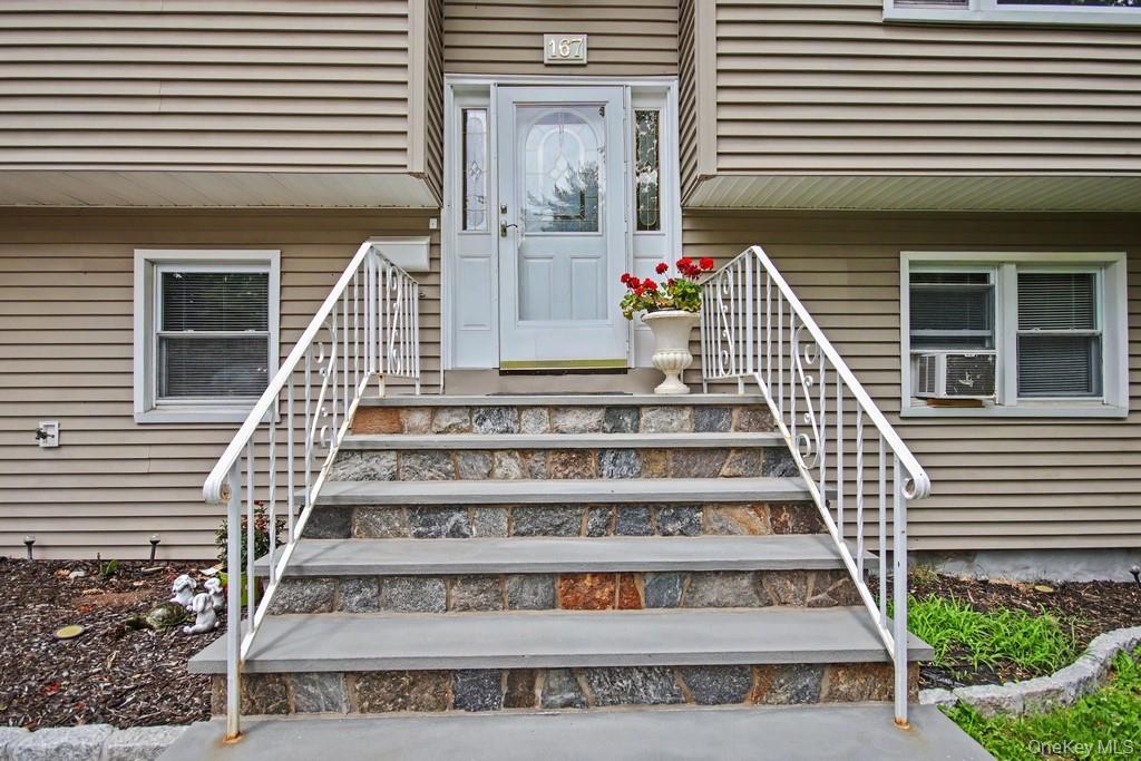 167 Kings Ferry Road Buchanan, NY 10511 - Photo 2 of 26 Entryway featuring natural stone-clad steps with bluestone treads and white metal railings