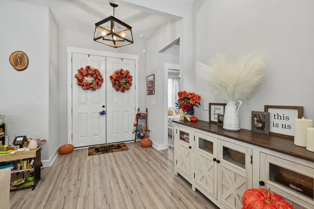 a kitchen with stainless steel appliances a stove a refrigerator and cabinets