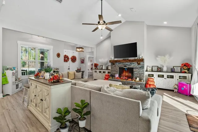 a kitchen with granite countertop lots of counter top space a sink and stainless steel appliances