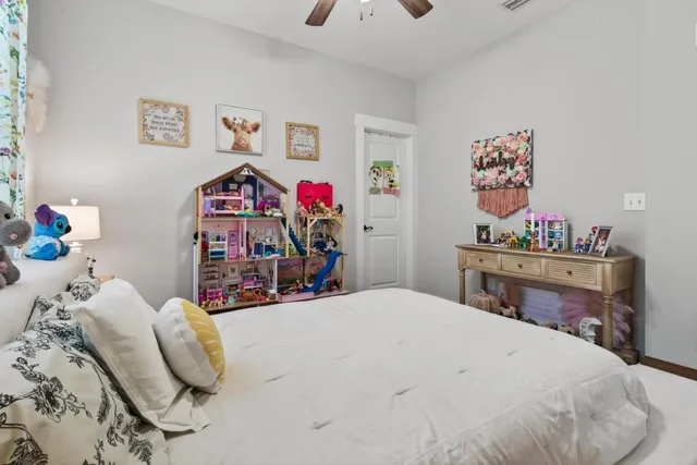 a view of kitchen with cabinets counter space and windows