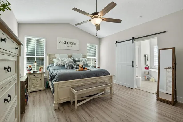 a view of a patio with a table and chairs under an umbrella