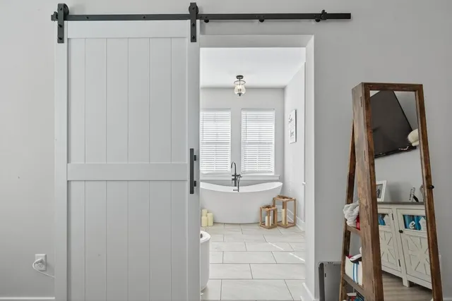a view of a house with swimming pool and porch with furniture