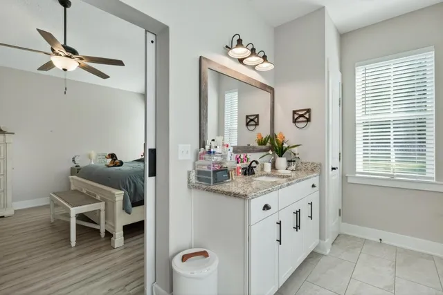 an aerial view of a house with swimming pool and lake view
