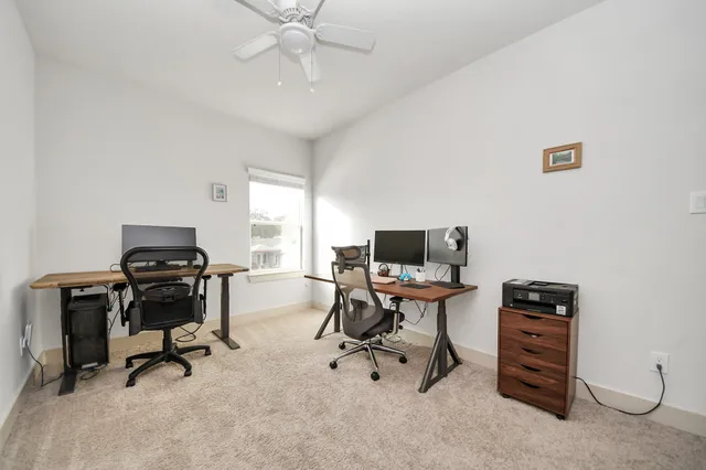 a view of a workspace with furniture