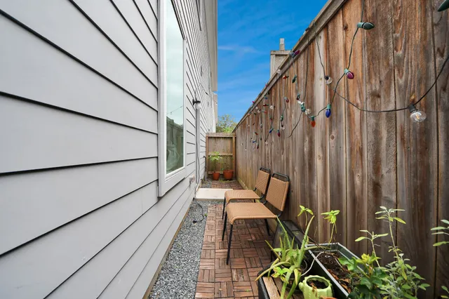 a view of balcony with furniture