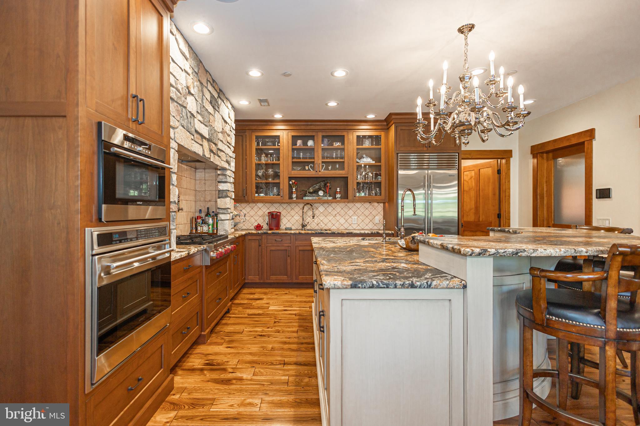992 A Worthington Mill Road Newtown, PA 18940 - Photo 22 of 96 a kitchen with stainless steel appliances granite countertop a stove top oven a sink dishwasher and cabinets with wooden floor