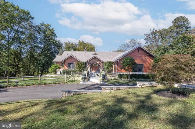 a front view of a house with outdoor seating