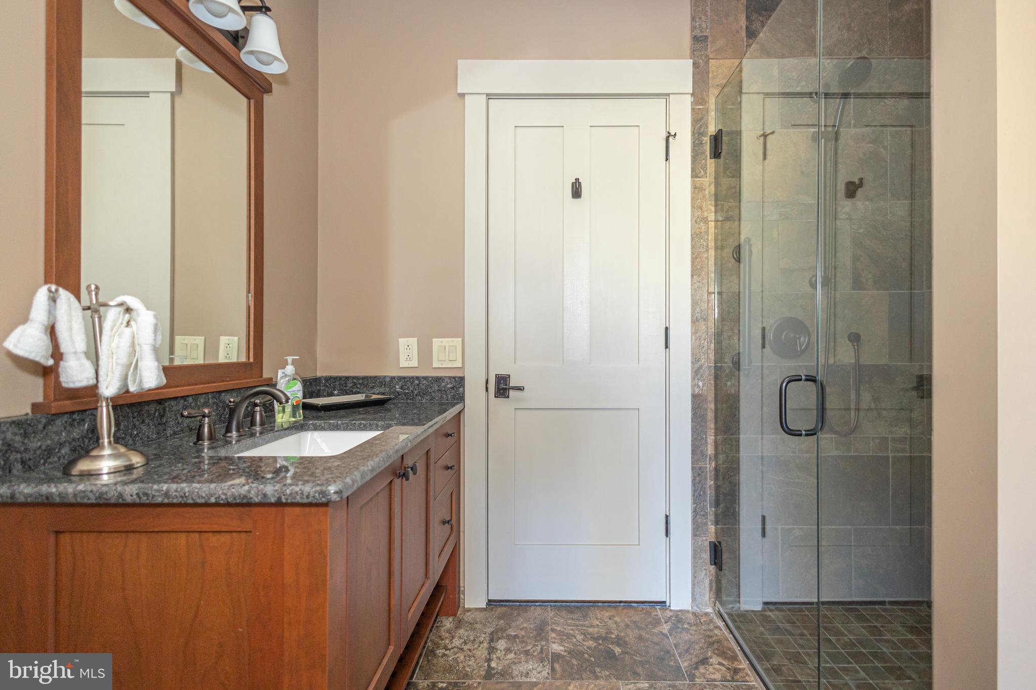 992 A Worthington Mill Road Newtown, PA 18940 - Photo 43 of 96 a bathroom with a granite countertop sink and a mirror