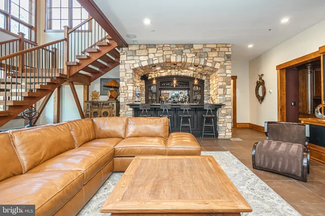 an aerial view of a house with yard and outdoor seating