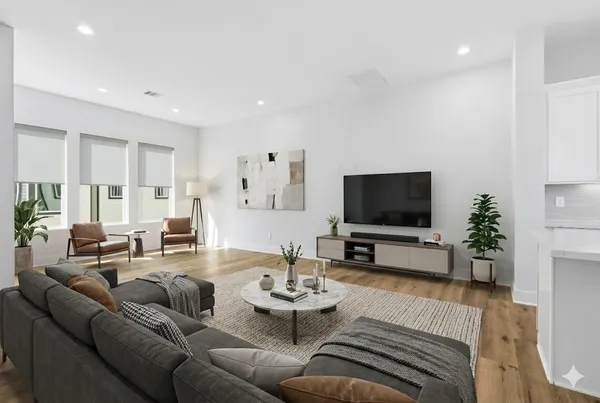 a view of a dining room with furniture window and wooden floor