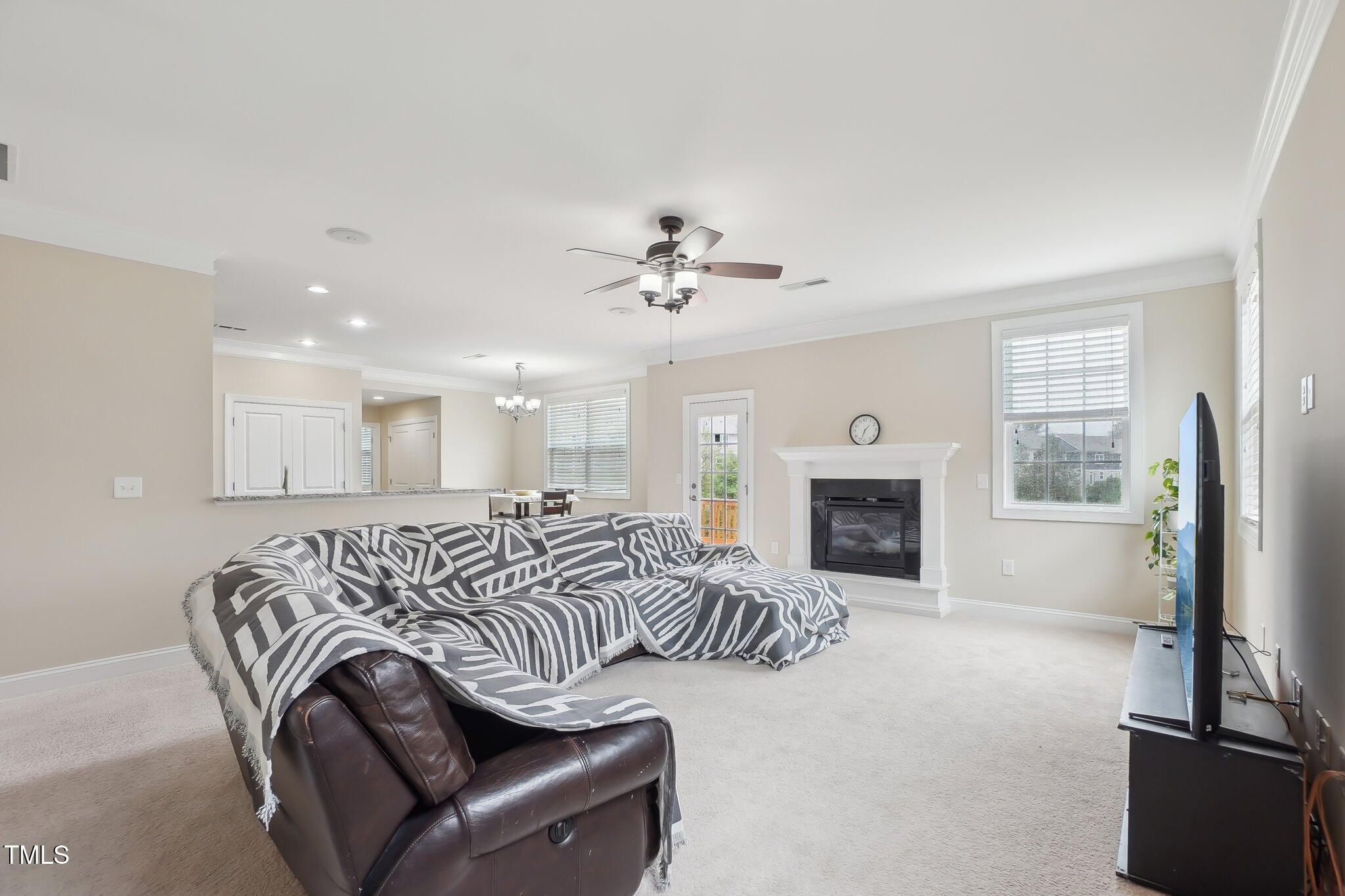 4008 Sykes Street Cary, NC 27519 - Photo 14 of 41 a view of a livingroom with a fireplace