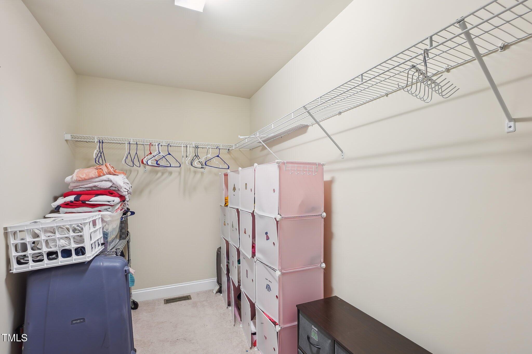4008 Sykes Street Cary, NC 27519 - Photo 22 of 41 a view of storage and utility room with empty racks