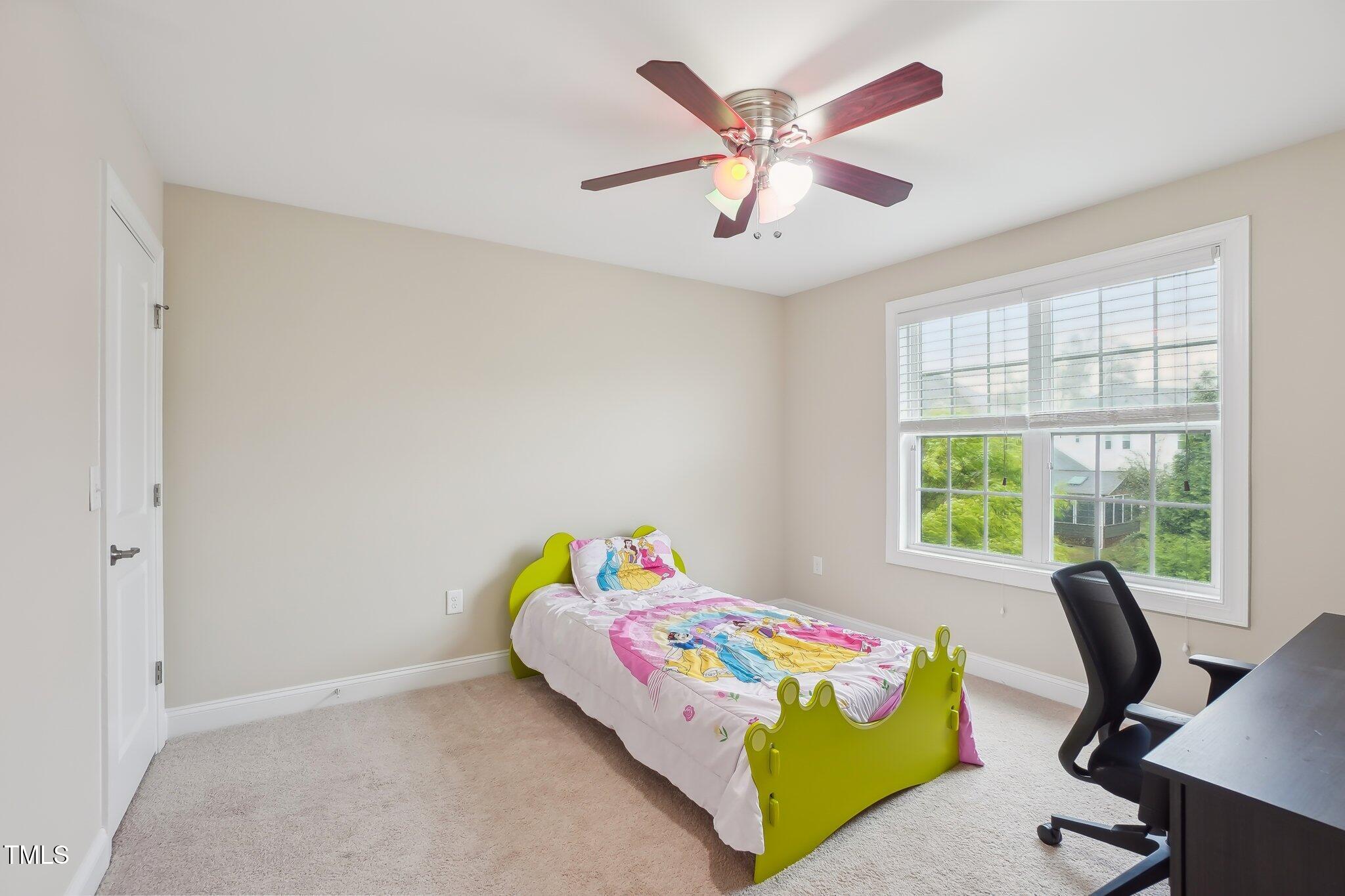 4008 Sykes Street Cary, NC 27519 - Photo 26 of 41 a bedroom with a bed and a window
