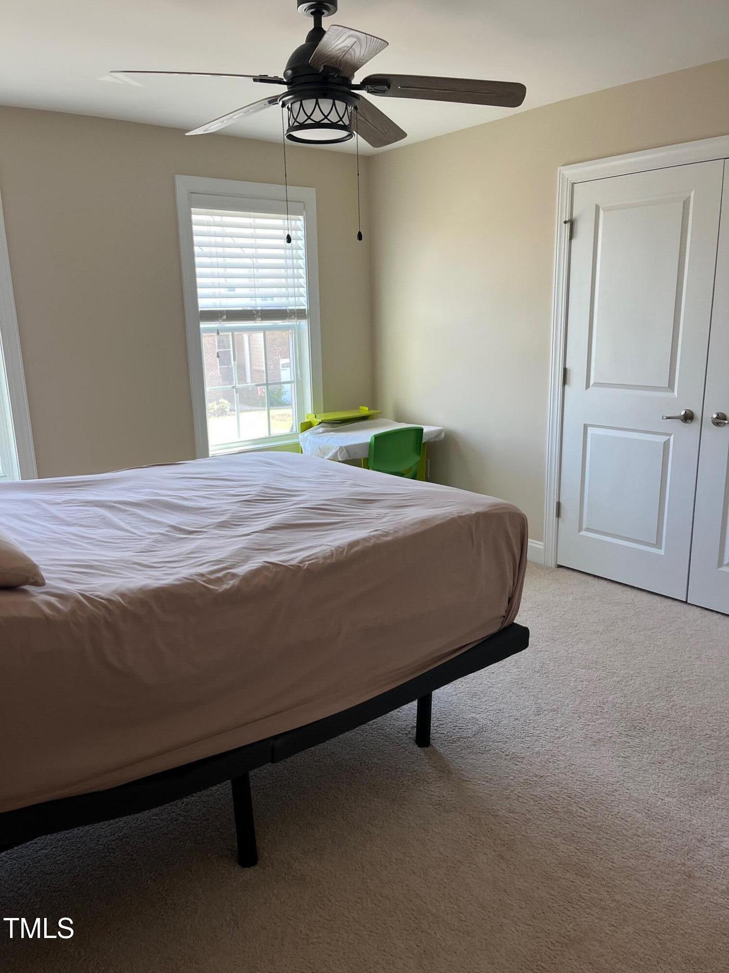 4008 Sykes Street Cary, NC 27519 - Photo 29 of 41 a bedroom with a bed and a window
