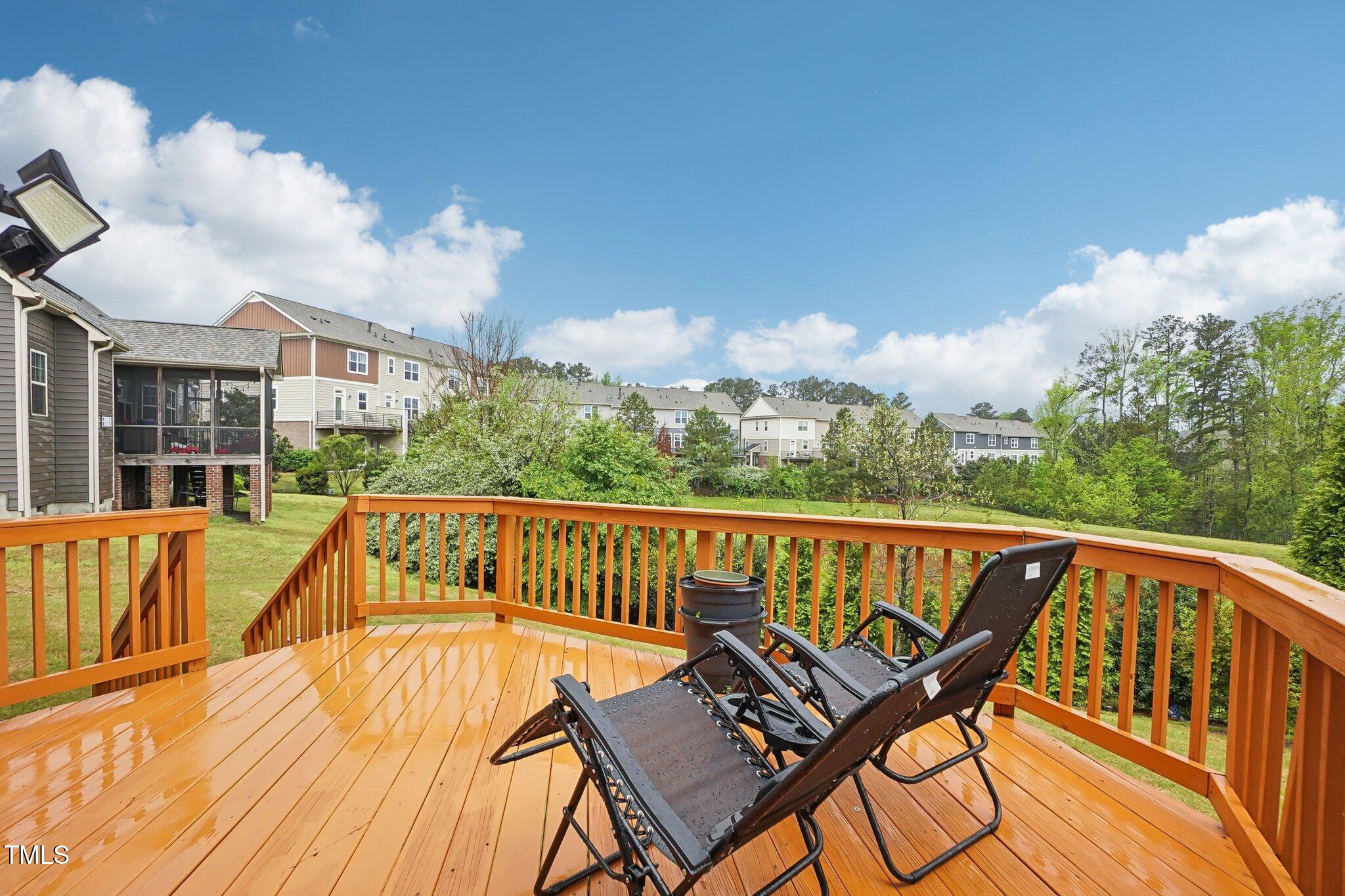 4008 Sykes Street Cary, NC 27519 - Photo 3 of 41 a view of a roof deck with couches and wooden floor