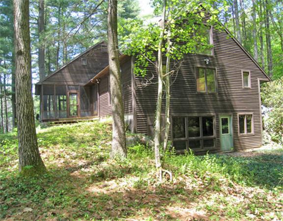 488 White Road Warwick, MA 01378 - Photo 16 of 30 a backyard of a house with plants and outdoor seating