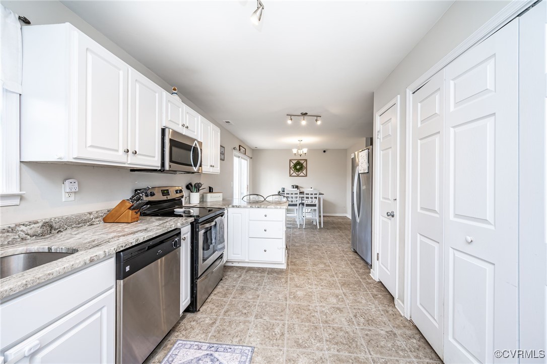 4959 Three Chopt Road Louisa, VA 23093 - Photo 12 of 28 Kitchen with view of dining area, pantry and laund