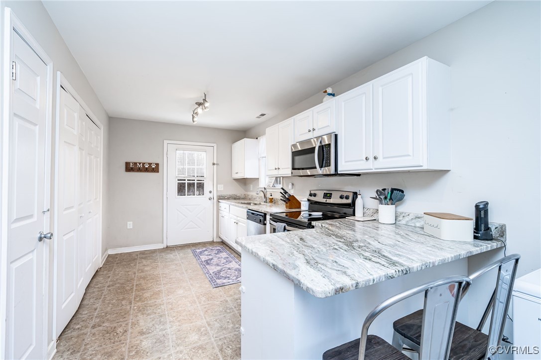 4959 Three Chopt Road Louisa, VA 23093 - Photo 10 of 28 Kitchen with view of pantry, laundry closet and ba